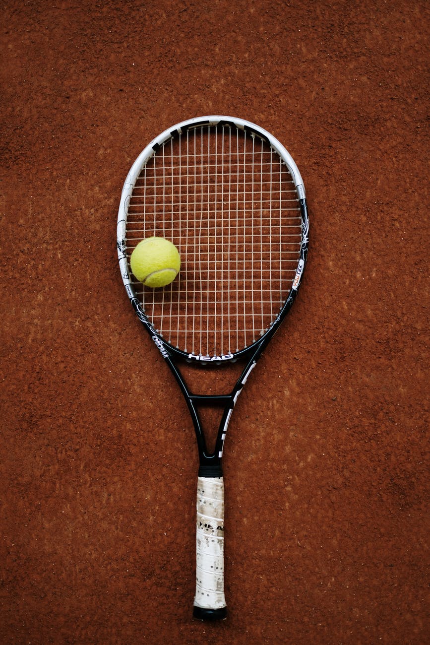 a tennis racket and a tennis ball