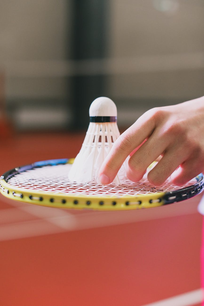 a shuttlecock on a badminton racket