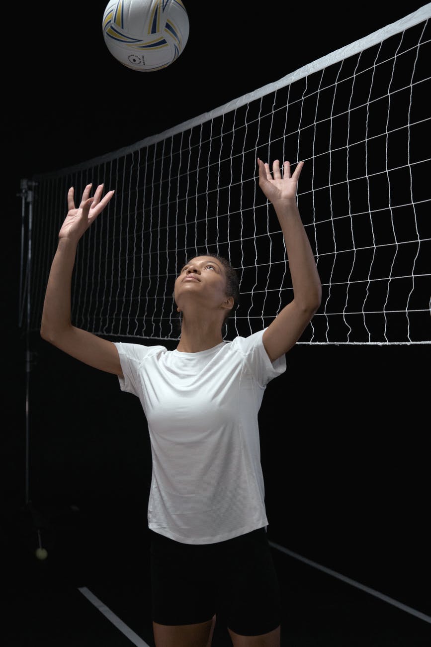 a woman playing volleyball